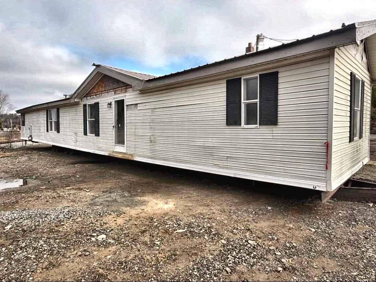 An older single-wide on a cleared lot