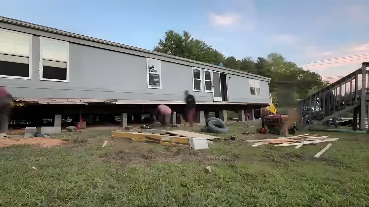 The crew setting a single-wide on blocks. Built by Asheville Modular and Mobile Home Services.